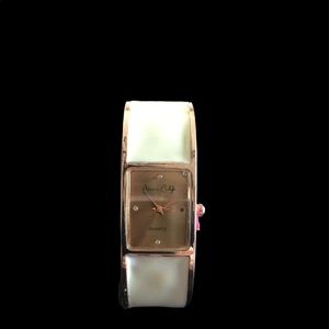 Gold and bone bangle watch